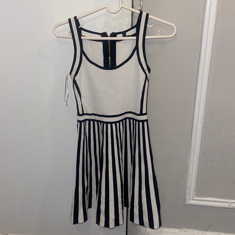 This is a Black and White bandage dress from Guess. Only wore once.Babydoll look
